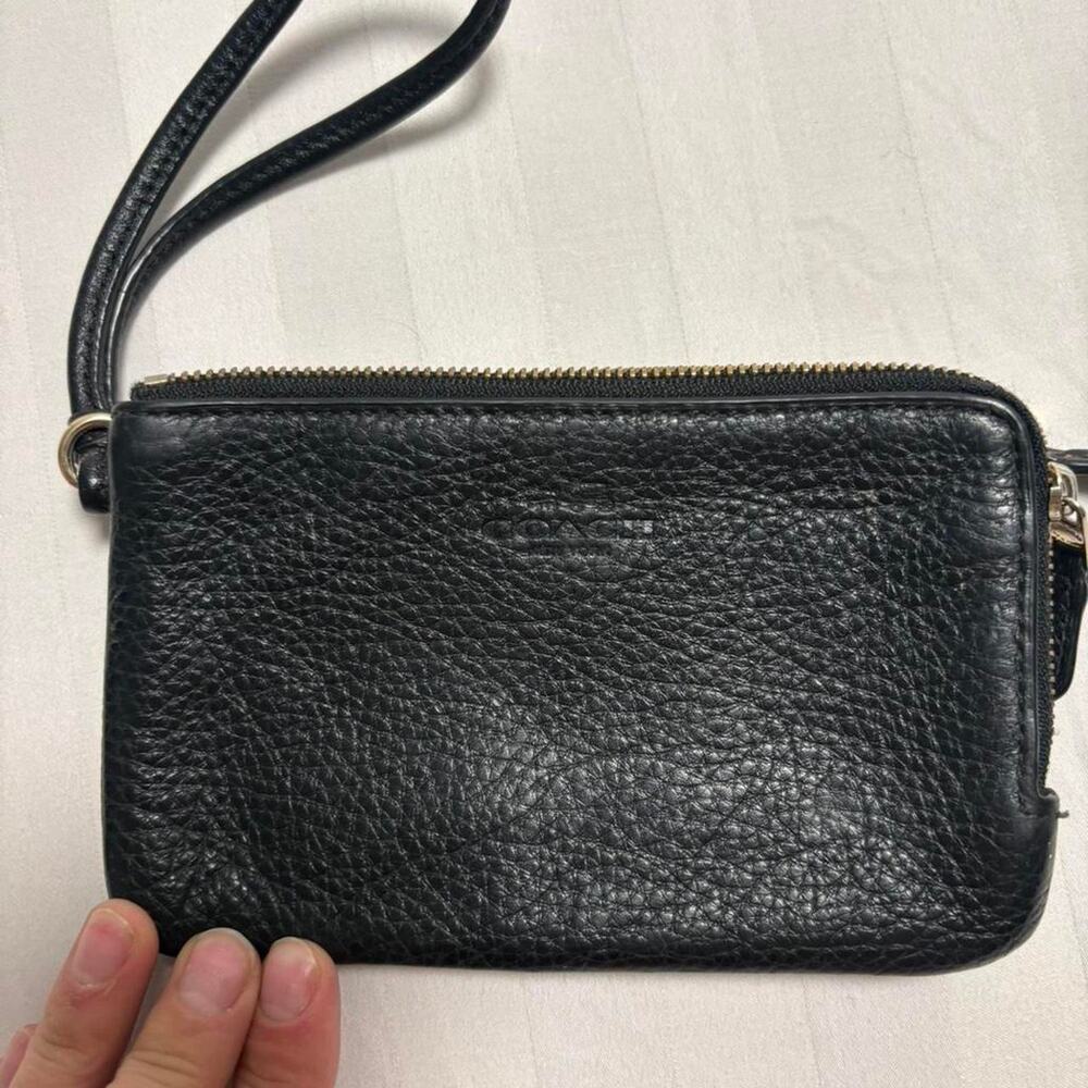 Black leather wristlet with gold
